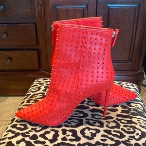 Spiked red high heels